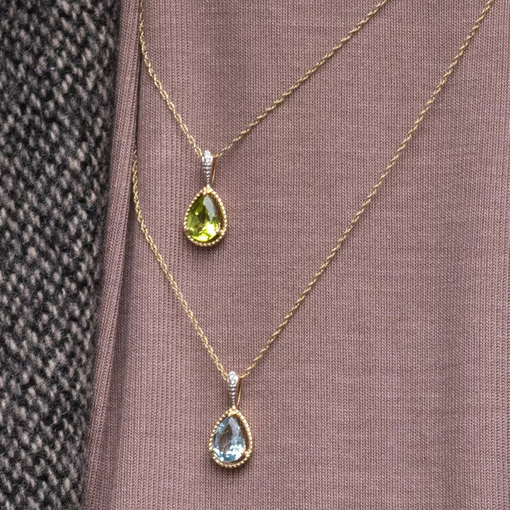 Collana classica con pendente a forma di pera, acquamarina e diamanti in oro giallo 9 carati