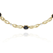 Bracciale da 19 cm con motivo infinito in oro giallo da 9 ct con zaffiri marquise e diamanti