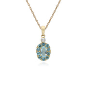Pendente con topazio azzurro rotondo in oro giallo da 9 ct e diamanti con montatura ovale su catena da 45 cm
