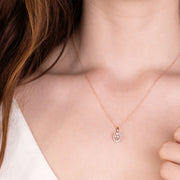 Classico pendente Halo ovale in Mrganite in oro rosa 375 e diamanti