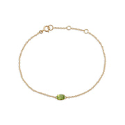 Classico bracciale e pendente ovale con peridoto in oro giallo 375
