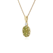 Pendente con peridoto rotondo e diamanti su montatura ovale in oro giallo da 9 ct su catena da 45 cm