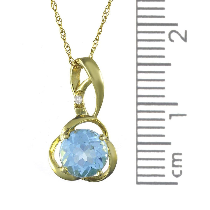 Ciondolo e orecchini floreali classici con topazio azzurro in oro giallo 375 e diamanti